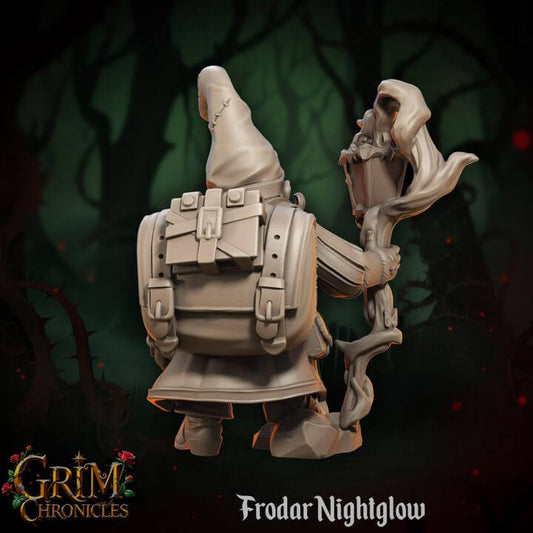 Frodar Nightglow Grim Chronicles character model in a dark forest setting, featuring detailed cloak and staff design.